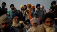 Farmers listen to a speaker as they attend a protest against the newly passed farm bills at Singhu border near Delhi, India, December 3, 2020. REUTERS/Danish Siddiqui
