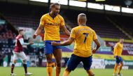 Everton's English striker Dominic Calvert-Lewin (L) celebrates after scoring the equalizing goal during the English Premier League football match between Burnley and Everton at Turf Moor in Burnley, north west England on December 5, 2020.  AFP / Clive Bru
