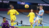 Manchester City's Belgian midfielder Kevin De Bruyne (R) has a shot saved by Fulham's French goalkeeper Alphonse Areola during the English Premier League football match between Manchester City and Fulham at the Etihad Stadium in Manchester, north west Eng
