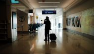 A pilot moves through New York's LaGuardia Airport on December 03, 2020 in New York City. Spencer Platt/AFP