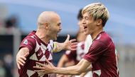 Kobe's midfielder Andres Iniesta celebrates his goal with teammates during the AFC Champions League round of 16 football match between Japan's Vissel Kobe and China's Shanghai SIPG on December 7, 2020 at the Khalifa International Stadium in the Qatari cap