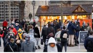 People walk by Christmas-themed food stalls at Breitscheidplatz square, amid the coronavirus disease (COVID-19) outbreak in Berlin, Germany, December 5, 2020. REUTERS/Fabrizio Bensch

