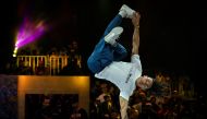 (FILES) In this file photo taken on November 9, 2019 Brazil's breakdancer Mateus de Sousa Melo aka Bart (white shirt) competes during the Red Bull BC One, the breakdance one-on-one battle world championship in Mumbai. The International Olympic Committee (