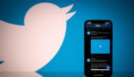(FILES) In this file photo taken on October 26, 2020 this photograph shows the logo of US social network Twitter displayed on the screen of a smartphone and a tablet in Toulouse, southern France. / AFP / Lionel BONAVENTURE
