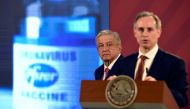 Mexican President Andres Manuel Lopez Obrador listens to Mexico's deputy Health Minister Hugo Lopez-Gatell during his daily press conference at the Palacio Nacional in Mexico City on December 8, 2020. / AFP / ALFREDO ESTRELLA
