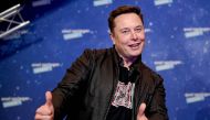 TOPSHOT - SpaceX owner and Tesla CEO Elon Musk poses as he arrives on the red carpet for the Axel Springer Awards ceremony, in Berlin, on December 1, 2020. / AFP / POOL / Britta Pedersen
