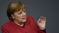German Chancellor Angela Merkel gestures as she speaks during a debate at the Bundestag (lower house of parliament) in Berlin on December 9, 2020, on the eve of an EU summit. AFP / Tobias Schwarz 