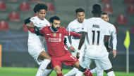 Liverpool's Egyptian forward Mohamed Salah (C) and Midtjylland's Swedish midfielder Jens Cajuste vie for the ball during the UEFA Champions League Group D football match FC Midtjylland v Liverpool FC in Herning, Denmark on December 9, 2020. Denmark OUT
/