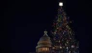 (FILES) In this file photo taken on December 02, 2020 the Capitol Christmas Tree is lit in front of the US Capitol in Washington, DC. Top US lawmakers scrambled December 6, 2020 to reach difficult agreements as quickly as possible on a new aid package for