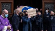 Italy's former football player Antonio Cabrini (R) and the son of Paolo Rossi, Alessandro Rossi (L), carry the coffin of the late Italian football player during his funeral at the Santa Maria Annunciata Cathedral in Vicenza, northeastern Italy, on Decembe