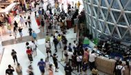 People wearing face masks following the coronavirus disease (COVID-19) outbreak shop at the Sanya International Duty-Free Shopping Complex in Sanya, Hainan province, China November 25, 2020. REUTERS/Tingshu Wang/File Photo