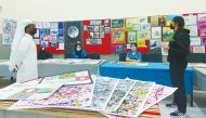 Students share their artworks with Qatari artist Mohammed Faraj Al Suwaidi. 