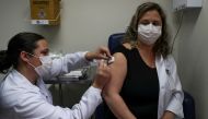 A nurse administers CoronaVac, a Sinovac's potential vaccine against the coronavirus disease (COVID-19), to a volunteer and nurse Sarah Rangon at Emilio Ribas Institute in Sao Paulo, Brazil July 30, 2020. Picture taken July 30, 2020. REUTERS/Amanda Perobe