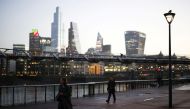 The financial district can be seen as a people walk along the South bank, amid the coronavirus disease (COVID-19) outbreak, in London, Britain, December 14, 2020. REUTERS/Henry Nicholls