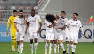 Al Sadd players celebrate during their match against Al Gharafa.