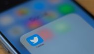 In this file photo taken on July 10, 2019 The Twitter logo is seen on a phone in this photo illustration in Washington, DC. / AFP / Alastair Pike