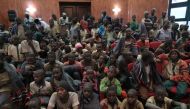 Released students gather at the Government House with other students from the Government Science Secondary school, in Kankara, in northwestern Katsina State, Nigeria upon their release on December 18, 2020. AFP / Kola Sulaimon 
