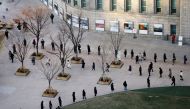 People wait in a line to undergo the coronavirus disease (COVID-19) test at a testing site which is temporarily set up at City Hall Plaza in Seoul, South Korea December 18, 2020. REUTERS/Heo Ran
