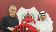 Al Rayyan's new French coach Laurent Blanc receiving a team jersey from Sheikh Ali bin Saud Al Thani yesterday.