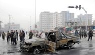 Afghan policemen inspect at the site of a blast in Kabul, Afghanistan December 20, 2020. REUTERS/Mohammad Ismail