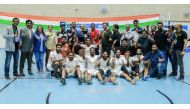 Mates Qatar players and officials celebrate winning the ISC Futsal Tournament.