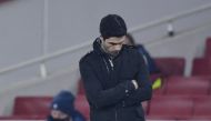 Arsenal manager Mikel Arteta looks dejected after Aymeric Laporte scored Manchester City's fourth goal REUTERS/Toby Melville 