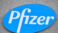 This photograph taken on December 22, 2020 in Puurs shows the logo of US multinational pharmaceutical company Pfizer at the production site of the Covid-19 vaccine that was given the European Union's green light the day before, paving the way for vaccinat