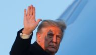 US President Donald Trump waves as he boards Air Force One at Joint Base Andrews in Maryland, US, December 23, 2020. Reuters/Tom Brenner 