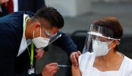 Maria Irene Ramirez receives the first injection with a dose of the Pfizer/BioNtech COVID-19 vaccine at General Hospital, as the coronavirus disease (COVID-19) outbreak continues, in Mexico City, Mexico December 24, 2020. REUTERS/Edgard Garrido