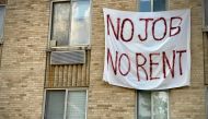 (FILES) In this file photo taken on August 09, 2020, a banner against renters eviction reading “no job, no rent” is displayed on a controlled rent building in Washington, DC. AFP / Eric Baradat 