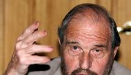 FILE PHOTO: Soviet secret agent George Blake gestures as he speaks at a presentation of a book of letters written by other spies from a British prison, in Moscow June 28, 2001.
