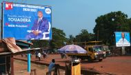 A campaign billboard of Central African Republic President Faustin Archange Touadera has seen the streets ahead of the upcoming elections in Bangui, the Central African Republic December 26, 2020. REUTERS/Antonie Rolland 