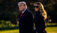 President Donald Trump and First Lady Melania Trump walk towards Marine One as they depart the White House en route to Mar-a-Lago, the President's private club, where they will spend Christmas and New Years Eve in Washington, DC on December 23, 2020./ AFP