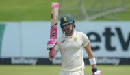 South Africa's Faf du Plessis celebrates after scoring his maiden 150 runs in a test match during the third day of the first Test cricket match between South Africa and Sri Lanka at SuperSport Park in Centurion on December 28, 2020. / AFP / Christiaan KOT