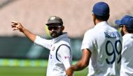India's Ajinkya Rahane (L) directs his players on the fourth day of the second cricket Test match between Australia and India at the MCG in Melbourne on December 29, 2020. AFP / William West  