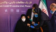 A woman receives an injection during the first trial phase of a locally-made Iranian vaccine for COVID-19 coronavirus disease in Iran's capital Tehran on December 29, 2020. / AFP 