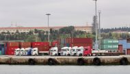 FILE PHOTO: Trucks and shipping containers are pictured at Haydarpasa port in Istanbul, Turkey, April 18, 2018. REUTERS/Yoruk Isik