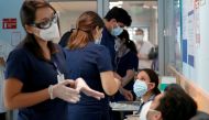 Healthcare workers prepare to receive the Pfizer/BioNtech vaccine against the coronavirus disease (COVID-19) at the Posta Central hospital in Santiago, Chile December 24, 2020. REUTERS/Ivan Alvarado
