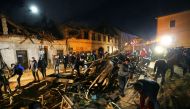People clean debris from a street after an earthquake, in Petrinja, Croatia December 29, 2020. REUTERS/Antonio Bronic
