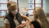 Medical staff is being innoculated with a dose of Pfizer-BioNTech COVID-19 vaccine at the University Hospital in Prague, on December 27, 2020. AFP / Michal Cizek
