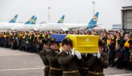 FILE PHOTO: Soldiers carry a coffin containing the remains of one of the eleven Ukrainian victims of the Ukraine International Airlines flight 752 plane disaster during a memorial ceremony at the Boryspil International Airport, outside Kiev, Ukraine Janua
