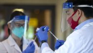 KIRKLAND, WA - DECEMBER 28: Pharmacists prepare doses of the COVID-19 vaccine at the Life Care Center of Kirkland on December 28, 2020 in Kirkland, Washington. The Life Care Center of Kirkland, a nursing home, was an early epicenter for coronavirus outbre