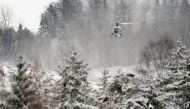 A helicopter flies over Ask in Gjerdrum municipality on December 31, 2020, one day after a major landslide and clay landslide. A major landslide destroyed homes overnight to December 30, 2020 in the village of Ask in Norway close to the capital Oslo, leav
