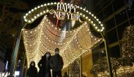 People visit a shopping district on New Year's Eve in Seoul on December 31, 2020. / AFP / Jung Yeon-je
