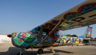 A two-seater Cessna aircraft painted with Pakistani truck art is seen at general aviation area at Jinnah International Airport in Karachi, Pakistan, December 30, 2020. Picture taken December 30, 2020. REUTERS/Akhtar Soomro
