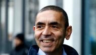 FILE PHOTO: CEO and co-founder of BioNTech, Ugur Sahin, answers journalists' questions after the European Medicines Agency (EMA) approved its COVID-19 vaccine, at the company headquarters in Mainz, Germany December 22, 2020. REUTERS/Ralph Orlowski/File Ph