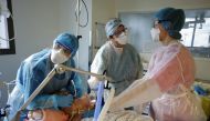 FILE PHOTO: Medical staff members work in the ICU where patients suffering from the coronavirus are treated at the Pasteur hospital in Nice, France, November 27, 2020. REUTERS/Eric Gaillard