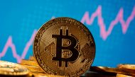 FILE PHOTO: A representation of virtual currency Bitcoin is seen in front of a stock graph in this illustration taken November 19, 2020. REUTERS/Dado Ruvic/Illustration