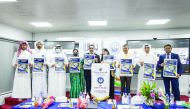 Ambassador of India to Qatar, Dr. Deepak Mittal, and President of Arab Engineers Forum, Eng. Jassim Ahmed Al Jolo, with other officials during souvenir release at the event.