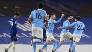 Soccer Football - Premier League - Chelsea v Manchester City - Stamford Bridge, London, Britain - January 3, 2021 Manchester City's Ilkay Gundogan celebrates scoring their first goal with Bernardo Silva and Phil Fodenv Pool via REUTERS/Shaun Botterill